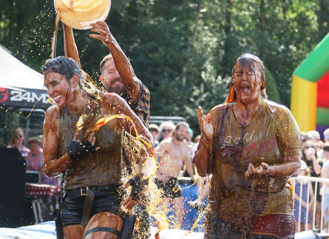 Fighters compete at the World Gravy Wrestling Championships at the The Rose ?N? Bowl in Rossendale. Points are scored on fun moves, costumes and how much you can make the crowd laugh. Photo released 25/08/2025