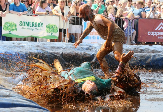 Fighters compete at the World Gravy Wrestling Championships at the The Rose ?N? Bowl in Rossendale. Points are scored on fun moves, costumes and how much you can make the crowd laugh. Photo released 25/08/2025