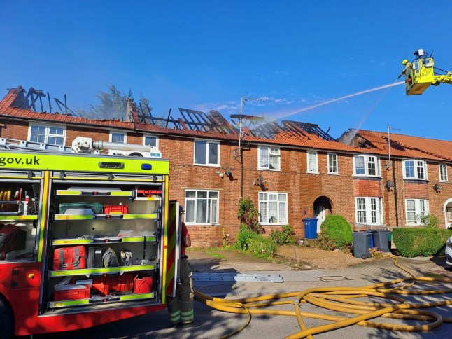 London Fire Brigade Ten fire engines and around 70 firefighters are tackling a fire at a row of terraced houses on Silkstream Road in Burnt Oak. The roof, most of the first floor and part of the ground floor of a mid terraced house is alight. The roof and half of the first floor of a second mid terraced house is alight. The rooves of two other terraced houses are also alight. Half of the roof of a fifth house is also alight. Local residents are advised to keep their windows and doors shut due to smoke travel in the area. One of the Brigade's 32-metre turntable ladders is being used as a water tower to help tackle the fire from above. Control Officers took the first of 36 calls at 1604 and have mobilised crews from Hendon, West Hampstead, Mill Hill and surrounding fire stations to the scene. The cause of the fire is not yet known.