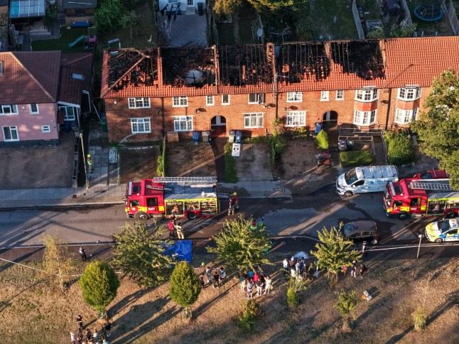 A major blaze has broken out in Burnt Oak, Barnet, with ten fire engines and around 70 firefighters tackling flames at a row of terraced houses. Terraced Properties Alight The London Fire Brigade (LFB) said they were called at 16:04 to reports of a fire on Silkstream Road. The roof and part of the first floor of a mid-terraced house are currently alight, and the roofs of three neighbouring properties have also been damaged by fire. Huge Response Control officers received 36 emergency calls about the incident. Crews from Hendon, West Hampstead, Mill Hill, and surrounding fire stations have been mobilised to the scene. Photos and video from nearby residents show thick smoke rising above Burnt Oak as firefighters work to contain the flames. Cause Not Yet Known The cause of the fire has not yet been established. There are no immediate reports of casualties. The Brigade said firefighters are expected to remain at the scene for several hours, and residents are advised to avoid the area while the response continues.