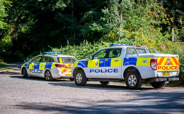 Savernake forest with a police guarding the cordon.