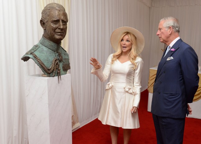 Britain's Prince Charles, Prince of Wales (R) is show a sculpture of himself, by the artist Frances Segelman, during a garden party to mark the 40th anniversary of The Prince's Trust charity, at Buckingham Palace in London on May 17, 2016. The Prince's Trust, a youth charity, helps disadvantaged young people to get their lives on track. Founded by The Prince of Wales in 1976, the charity is celebrating 40 years of supporting 13 to 30 year-olds who are unemployed, struggling at school or at risk of exclusion. / AFP / Anthony Devlin (Photo credit should read ANTHONY DEVLIN/AFP via Getty Images)