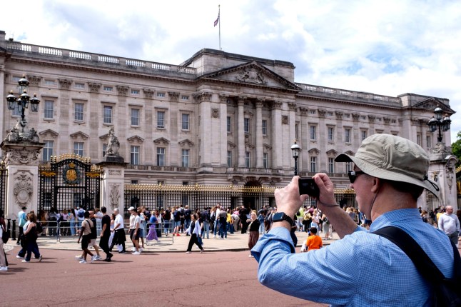 Tourists and domestic visitors at Buckingham Palace on 7th July 2025 in London, United Kingdom. London is one of the worlds leading tourism destinations, with many famous tourist attractions. The city attracts millions international visitors as well as domestic tourists and day-trippers each year. The Travel & Tourism sector in the UK contributes greatly to the economy, with the tourism sector employing some 700,000 people. (photo by Mike Kemp/In Pictures via Getty Images)