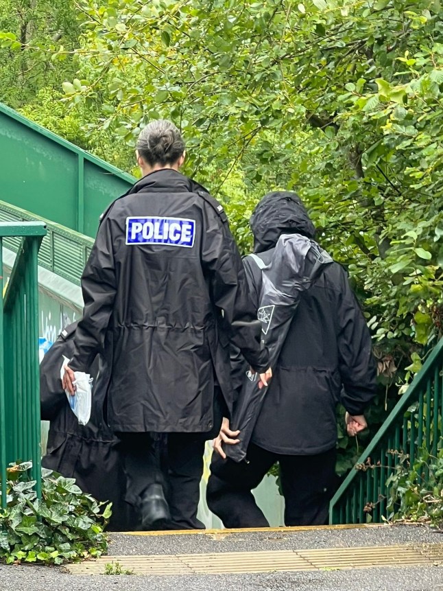 Detectives have launched a murder investigation following the death of a 28-year-old woman in Tilehurst, Reading. Thames Valley Police said officers were called to the riverbank behind Tilehurst Station at around 11.30pm on Sunday, 24 August, after reports of a cardiac arrest. Murder Arrest After Woman Dies in Tilehurst, Reading The woman was taken to hospital, but despite the efforts of medical teams she was later pronounced dead. A 39-year-old man from Reading was arrested at the scene on suspicion of murder and remains in police custody. While the incident occurred just a mile from the Reading Festival site, detectives said they do not believe those involved had attended the event. Murder Arrest After Woman Dies in Tilehurst, Reading Detective Inspector Alice Broad, from the force???s Major Crime Unit, said: ???We understand this unexplained death and arrest will be of concern but we do not believe there is any threat to the wider public. Murder Arrest After Woman Dies in Tilehurst, Reading While we have arrested a man on suspicion of murder, the woman???s death is currently unexplained and the suspect remains in our custody. Murder Arrest After Woman Dies in Tilehurst, Reading While the deceased woman has not been formally identified as we have not spoken to her next of kin yet, we believe she was staying in the area and knew the suspect. Please be considerate that her next of kin are not aware when posting online. We are in the early stages of a complex investigation but we are following a number of lines of enquiry to establish the circumstances around the death.??? A police cordon remained in place on Tuesday but was expected to be lifted later in the day. Murder Arrest After Woman Dies in Tilehurst, Reading The coroner has been informed. Police are urging anyone with information to call 101 or visit the Thames Valley Police website, quoting incident reference 43250434350. Alternatively, information can be passed ano