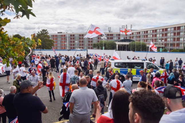 Mandatory Credit: Photo by Vuk Valcic/ZUMA Press Wire/Shutterstock (15463589b) Crowds of anti-migrant demonstrators holding English flags and Union Jacks gather outside the Crowne Plaza hotel in West Drayton in protest against housing asylum seekers in hotels. Anti-Migrant Protest Outside The Crowne Plaza Hotel In West Drayton, London, England, United Kingdom - 30 Aug 2025