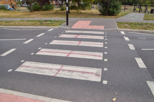 Mandatory Credit: Photo by Vuk Valcic/ZUMA Press Wire/Shutterstock (15463589n) A pedestrian crossing is daubed with red paint to resemble a St George's Cross (England flag) in West Drayton as protests against housing asylum seekers in hotels continue. Anti-Migrant Protest Outside The Crowne Plaza Hotel In West Drayton, London, England, United Kingdom - 30 Aug 2025