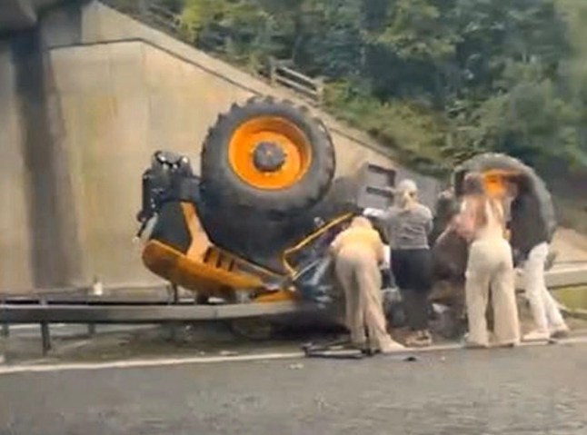 Group of women rush to help tractor driver who flipped off bridge onto busy M20 post thumbnail image