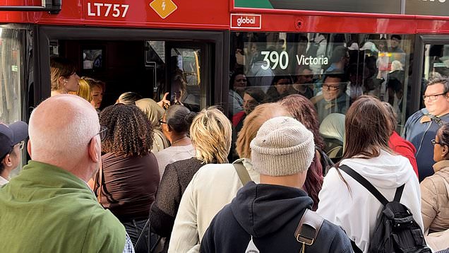 People queueing to get into a bus in London during the Tube strike.