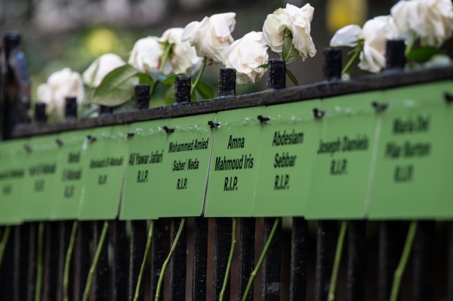 LONDON, ENGLAND - JUNE 14: A floral tribute near Grenfell Tower on June 14, 2025 in London, England. On June 14th 2017, a fire ripped through Grenfell Tower in North Kensington, West London, killing 72 people and injuring 70. It became the worst residential fire on the UK since the Blitz. (Photo by Guy Smallman/Getty Images)