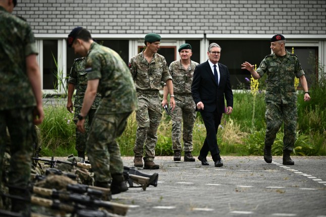 Britain's Prime Minister Keir Starmer, center, visits the Netherlands marines training base, as part of the UK-Netherlands Joint Amphibious Force in Rotterdam, Netherlands, Tuesday, June 24, 2025, on the sidelines of the NATO summit. (Ben Stansall/Pool via AP)