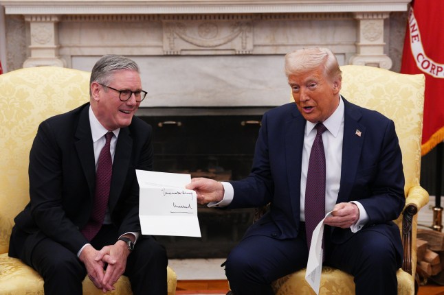 File photo dated 27/02/25 of US President Donald Trump is presented with a letter from King Charles III, who invited him for an unprecedented second state visit, during his meeting with Prime Minister Sir Keir Starmer in the Oval Office at the White House in Washington DC. Donald Trump is to make a full state visit to the UK this year after the King and the US president???s busy diaries mean they are unable to meet informally first over the summer, it is understood. Issue date: Wednesday June 25, 2025. PA Photo. Photo credit should read: Carl Court/PA Wire