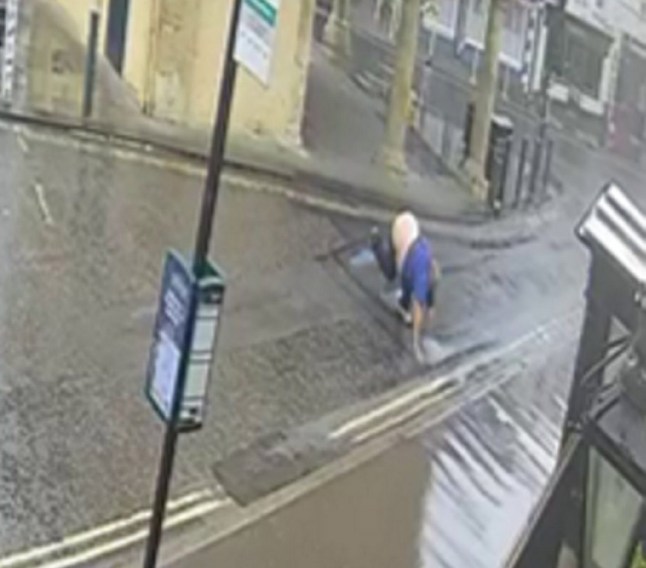 A man falling over on the uneven road in Faringdon, Oxfordshire.