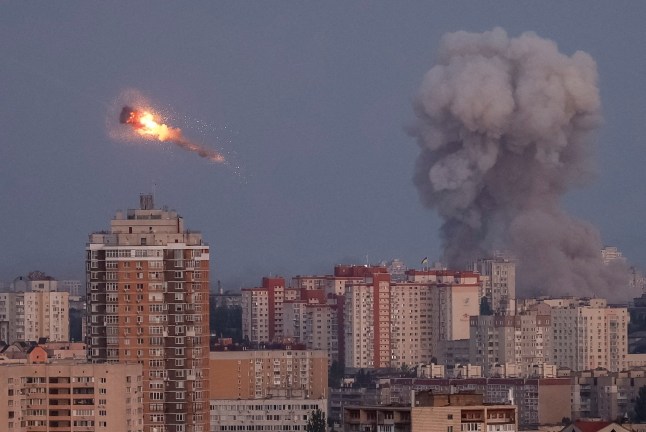Ukrainian servicemen shoot down a Russian missile as smoke rises from the city during a Russian missile strike, amid Russia's attack on Ukraine, in Kyiv, Ukraine September 7, 2025. REUTERS/Gleb Garanich TPX IMAGES OF THE DAY