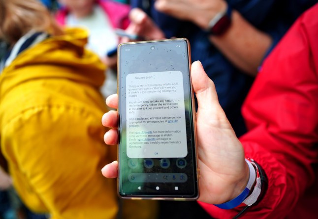An emergency alert test on a phone screen ahead of the Women's Rugby World Cup 2025 pool D match at the Brighton and Hove Albion Stadium, Brighton. Siren sounds have blared from mobile phones across the country in a test of the national emergency alert system. Picture date: Sunday September 7, 2025. PA Photo. Photo credit should read: Ben Whitley/PA Wire. RESTRICTIONS: Use subject to restrictions. Editorial use only, no commercial use without prior consent from rights holder.