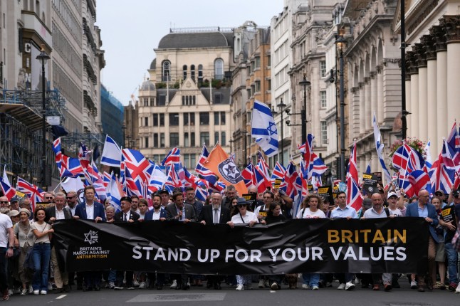 Former Conservative cabinet minister Michael Gove, Reform UK Deputy Leader Richard Tice and Chief Rabbi Ephraim Mirvis lead a 'march against antisemitism' demonstration in central London, on September 7, 2025, (Photo by CARLOS JASSO / AFP) (Photo by CARLOS JASSO/AFP via Getty Images)