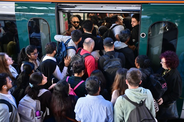 Commuters board a train at Harrow and Wealdstone station during a week-long strike on the London underground Tube Strikes, London, UK - 09 Sep 2025