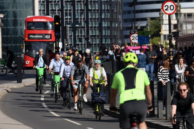 Cyclists make their way through Westmister as tube rail strikes continue in London, Britain, September 9, 2025. REUTERS/Jack Taylor