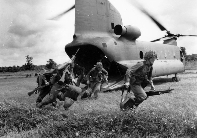 Mandatory Credit: Photo by The Art Archive/Shutterstock (5850792og) Men from newly arrived 6th Battalion sprint from US Air Force Chinook helicopter ready for action, South Vietnam Art (Military) - various