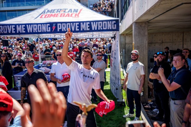 U.S. right-wing activist and commentator Charlie Kirk throws hats to the crowd shortly before he was shot at a Utah Valley University speaking event in Orem, Utah, U.S. September 10, 2025. Trent Nelson/The Salt Lake Tribune via REUTERS. NO RESALES. NO ARCHIVES. THIS IMAGE HAS BEEN SUPPLIED BY A THIRD PARTY