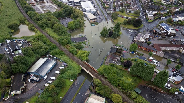 Pictured: Aerial view of the flooded Cwmbwrla roundabout in Swansea. Sunday 14 September 2025 Re: Heavy rain causes flash flooding during which drivers had to be rescued from their submerged cars at Cwmbwrla roundabout, Swansea, Wales, UK.