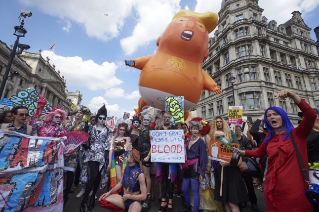 A giant balloon depicting US President Donald Trump as an orange baby joins drag queens and protesters against the UK visit of US President Donald Trump as they take part in a march and rally in London on July 13, 2018.